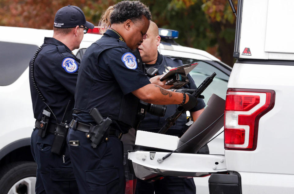 Capitol Police search a vehicle after arresting a man who was in possession of a firearm outside the Capitol. (Alex Wong / Getty Images)