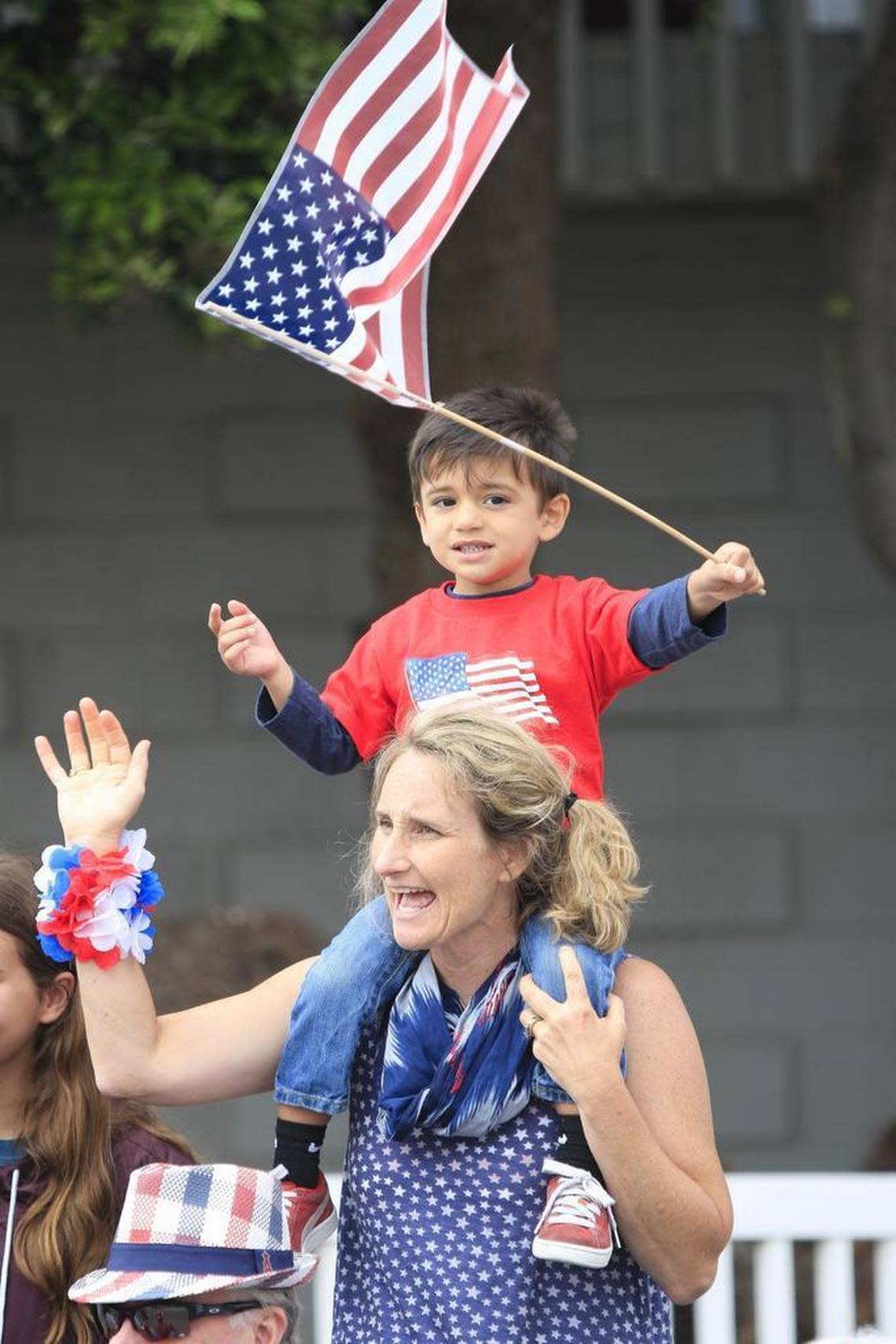 Claudia Aghoian of Morro Bay holds her grandson, Noah Prieto, 3, of Northridge on her shoulders while they enjoy the 2017 Fourth of July Parade in Cayucos.