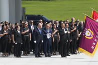 New Zealand's Prime Minister Christopher Luxon, center left, stands at attention during a visit to National Cemetery in Seoul, South Korea, Wednesday, Sept. 4, 2024. (AP Photo/Ahn Young-joon)