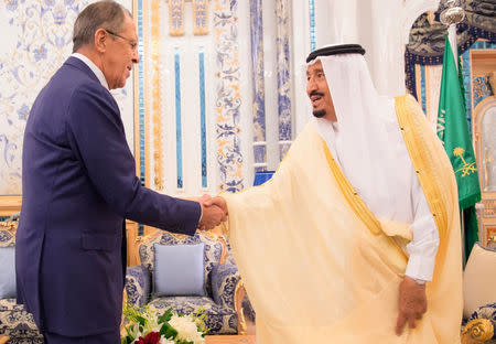 Saudi Arabia's King Salman bin Abdulaziz Al Saud (R) shakes hands with Russia's Foreign Minister Sergei Lavrov in Jeddah, Saudi Arabia September 10, 2017. Saudi Press Agency/Handout via REUTERS