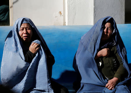 Afghan women mourn inside a hospital compound after a suicide attack in Kabul, Afghanistan December 28, 2017. REUTERS/Mohammad Ismail