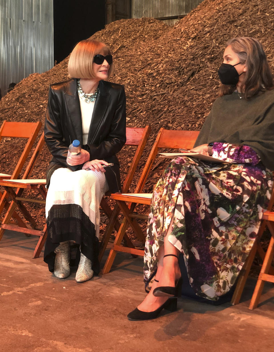 Anna Wintour, left, attends the Alexander McQueen Autumn/Winter 2022 collection presentation on Tuesday, March 15, 2022 in New York. (AP Photo/Leanne Italie)