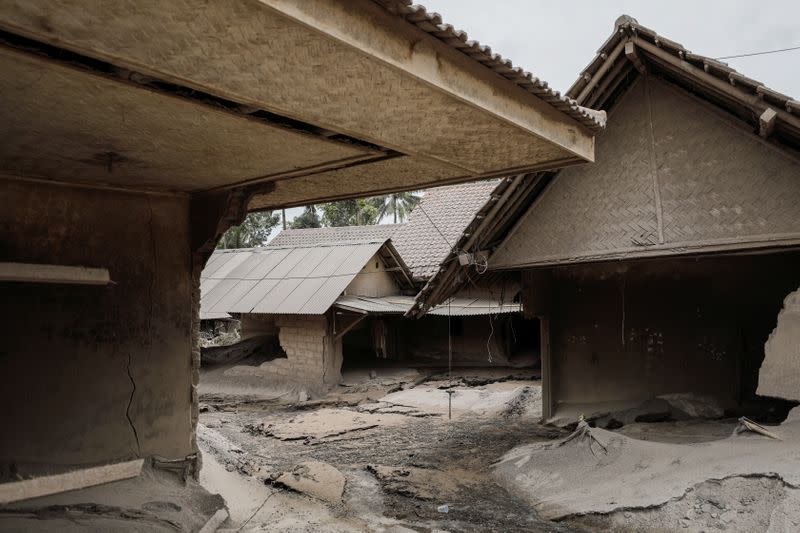 Damaged houses are seen at the Sumberwuluh village following the eruption of Semeru mount volcano in Lumajang regency