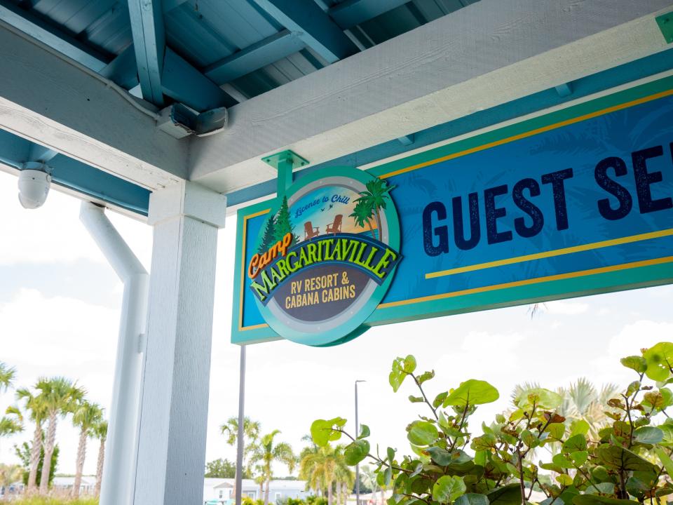 Camp Margaritaville logo next to a sign that reads "Guest Se"