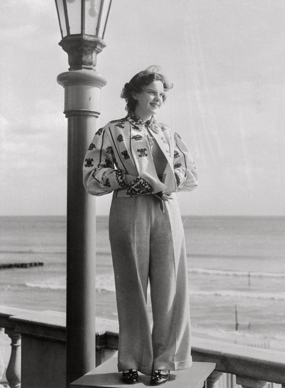 Garland stands for a portrait at the Roney Plaza Cabana Sun Club in Miami around the time her film "Everybody Sing" premiered.