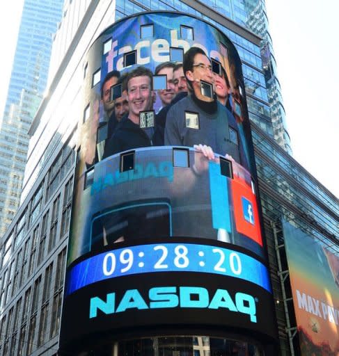 Facebook co-founder Mark Zuckerberg is seen on a screen getting ready to ring the NASDAQ stock exchange opening bell in Times Square in New York on May 18. The initial public offering last week which raised a record $16 billion has sparked fury, and lawsuits, amid concerns that key information about the outlook for the social network giant might not have been made widely available