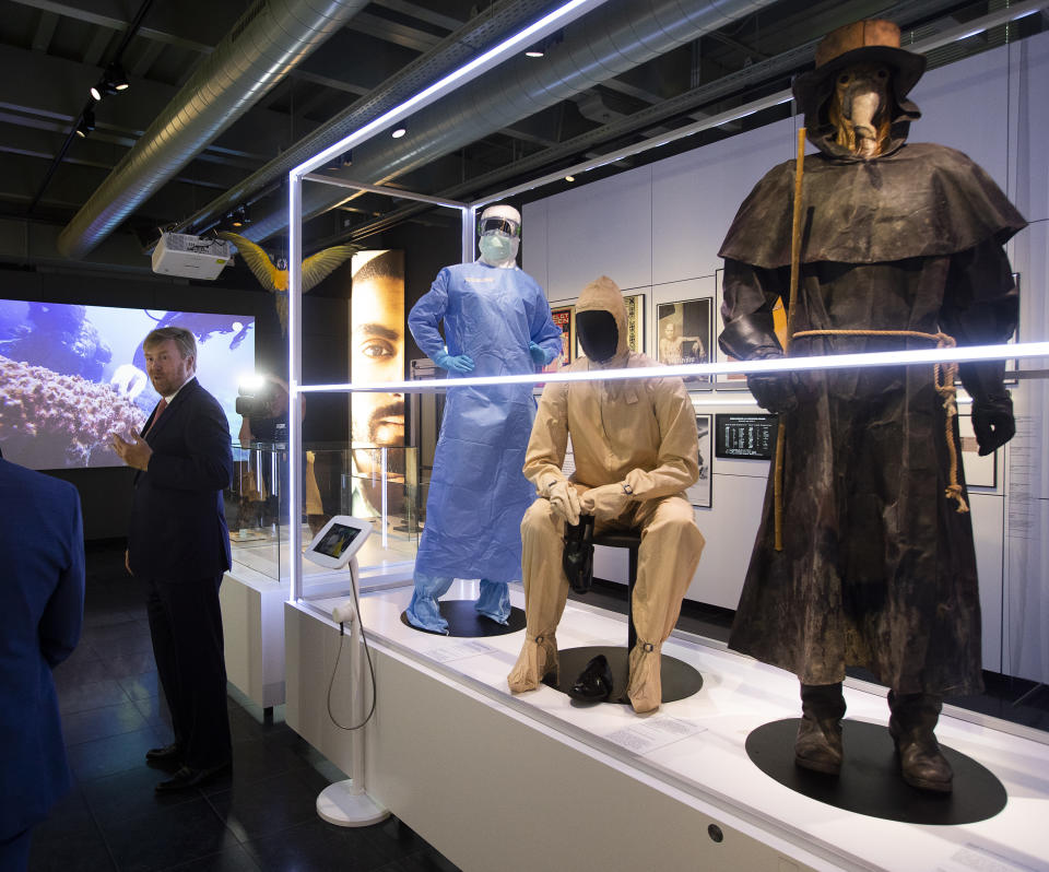 Dutch King Willem-Alexander tours the "Contagious!" exhibit at Rijksmuseum Boerhave in Leiden, Netherlands, Thursday, July 16, 2020. The museum finally opened an exhibition Thursday on contagious diseases through the ages after a long delay caused by the disease currently sweeping the world, COVID-19. (AP Photo/Peter Dejong, Pool)