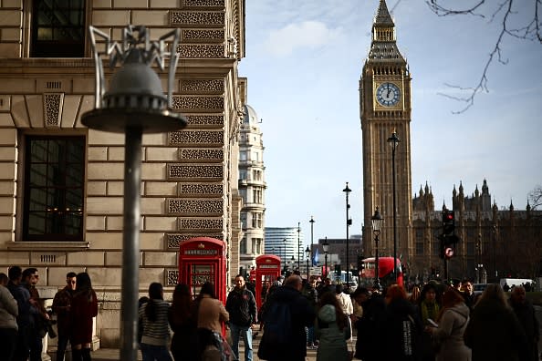 Pedestrians walk by The Elizabeth Tower, commonly known by the name of the clock's bell "Big Ben", at the Palace of Westminster, home to the Houses of Parliament, in central London, on January 24, 2024.  (Photo by HENRY NICHOLLS / AFP) (Photo by HENRY NICHOLLS/AFP via Getty Images)