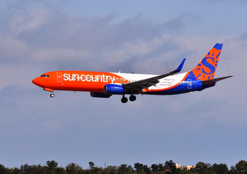 The first Sun Country jet from Minneapolis-St. Paul on a new nonstop seasonal service descends to the runway Friday morning at Melbourne Orlando International Airport.