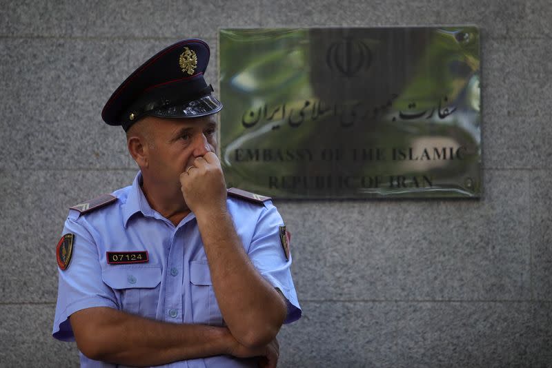A police officer stands in front of the Embassy of the Islamic Republic of Iran, in Tirana