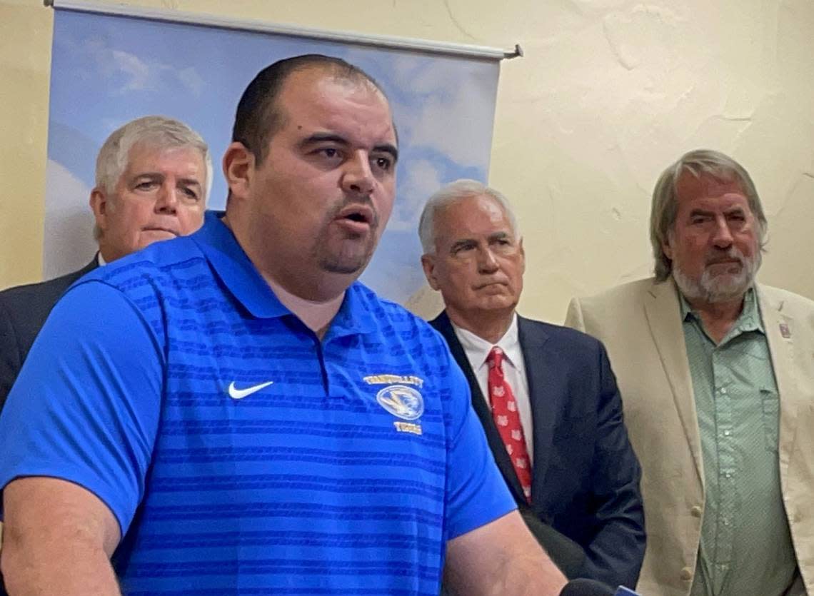 Mayor Victor Martinez of Mendota, California, speaks to reporters after a congressional hearing on San Joaquin Valley water issues on Sept. 6, 2024. At rear from left are Republican subcommittee Chairman Cliff Bentz of Oregon; Rep. Tom McClintock, R-Elk Grove; and Rep. Doug LaMalfa, R-Butte County.