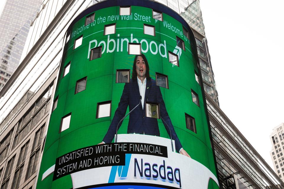 Robinhood Vlad standing at Nasdaq time square billboard