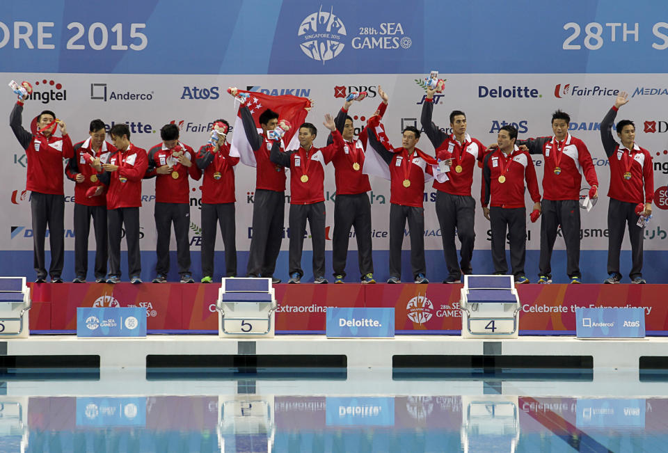 28th SEA Games Singapore 2015 - OCBC Aquatic Centre, Singapore - 16/6/15   Water Polo - Men's Round Robin - Singapore v Indonesia - The Singapore team celebrates winning the gold medal  TEAMSINGAPORE  Mandatory Credit: Singapore SEA Games Organising Committee / Action Images via Reuters