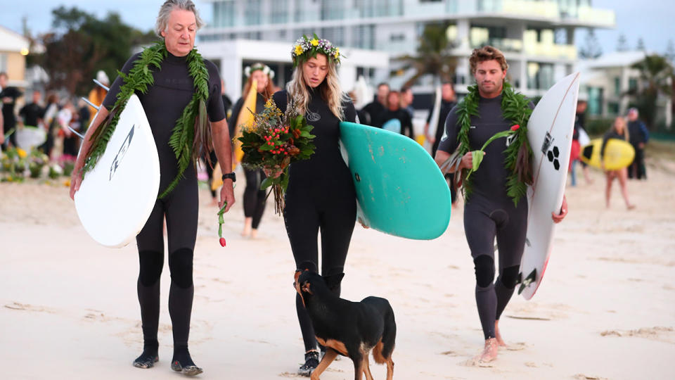 Alex Pullin's father and girlfriend Ellidy Vlug, pictured here paying their respects at Palm Beach.