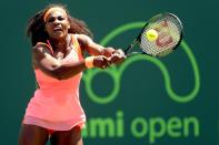 Serena Williams returns a shot to Svetlana Kuznetsova during their Miami Open match on March 30, 2015 in Key Biscayne