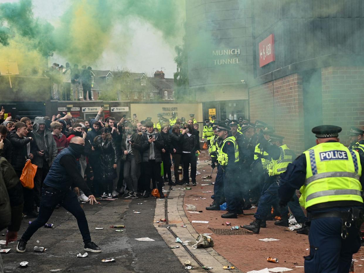 Supporters clash with police during a protest against Manchester United’s owners (AFP/Getty)