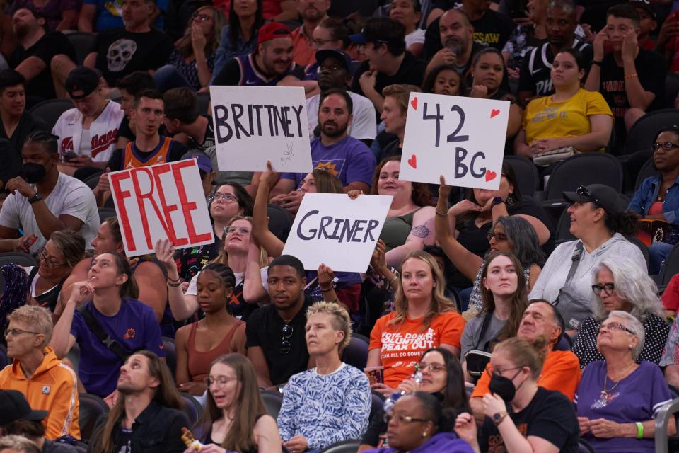 Jun 3, 2022; Phoenix, AZ, USA; Phoenix Mercury fans hold signs in support of Phoenix Mercury center Brittney Griner (42), who has been detained in Russia since February, at Footprint Center.