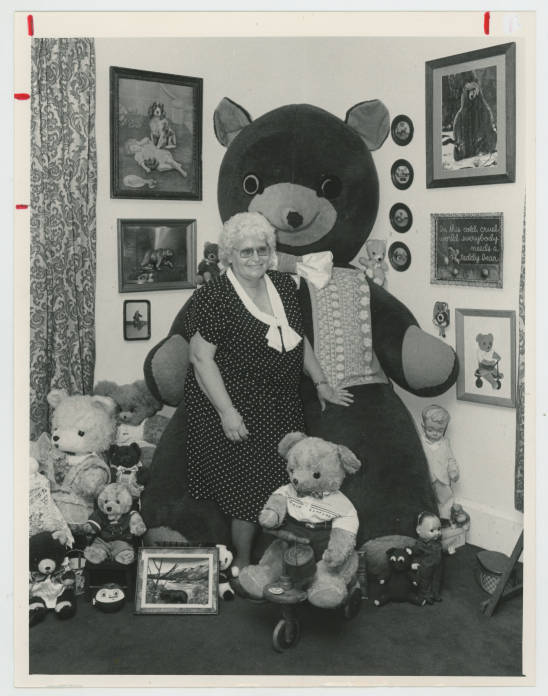 Tina Slayter poses with Edgar, the largest item in her collection of, at the time, 1,400 teddy bears.