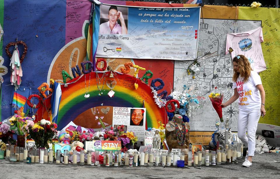 <p>Pulse nightclub owner Barbara Poma tends to the memorial in front of her club on Saturday, June 10, 2017, in Orlando, Fla. (Joe Burbank/Orlando Sentinel/TNS via Getty Images) </p>