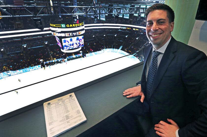 Calgary Flames assistant general manager Chris Snow poses for a portrait in a press box above the ice