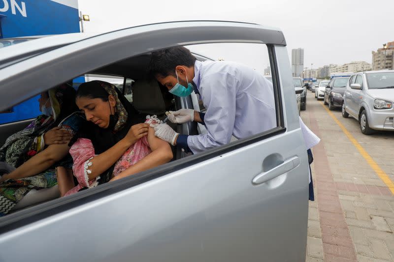 Coronavirus disease (COVID-19) drive-through vaccination facility in Karachi