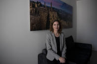 Israel's new Minister of Environmental Protection, Tamar Zandberg, poses for a portrait in her office in Jerusalem, Wednesday, Oct. 20, 2021. Zandberg has set some ambitious goals: She believes she can use her office to play an important role in the global battle against climate change while also promoting peace in the volatile Middle East. (AP Photo/Maya Alleruzzo)