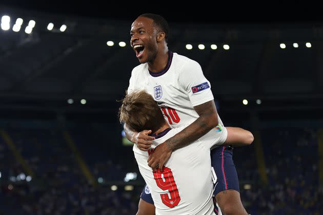 Raheem Sterling and teammate Harry Kane after victory against Ukraine in the quarter-finals. (Photo: Eddie Keogh - The FA via Getty Images)