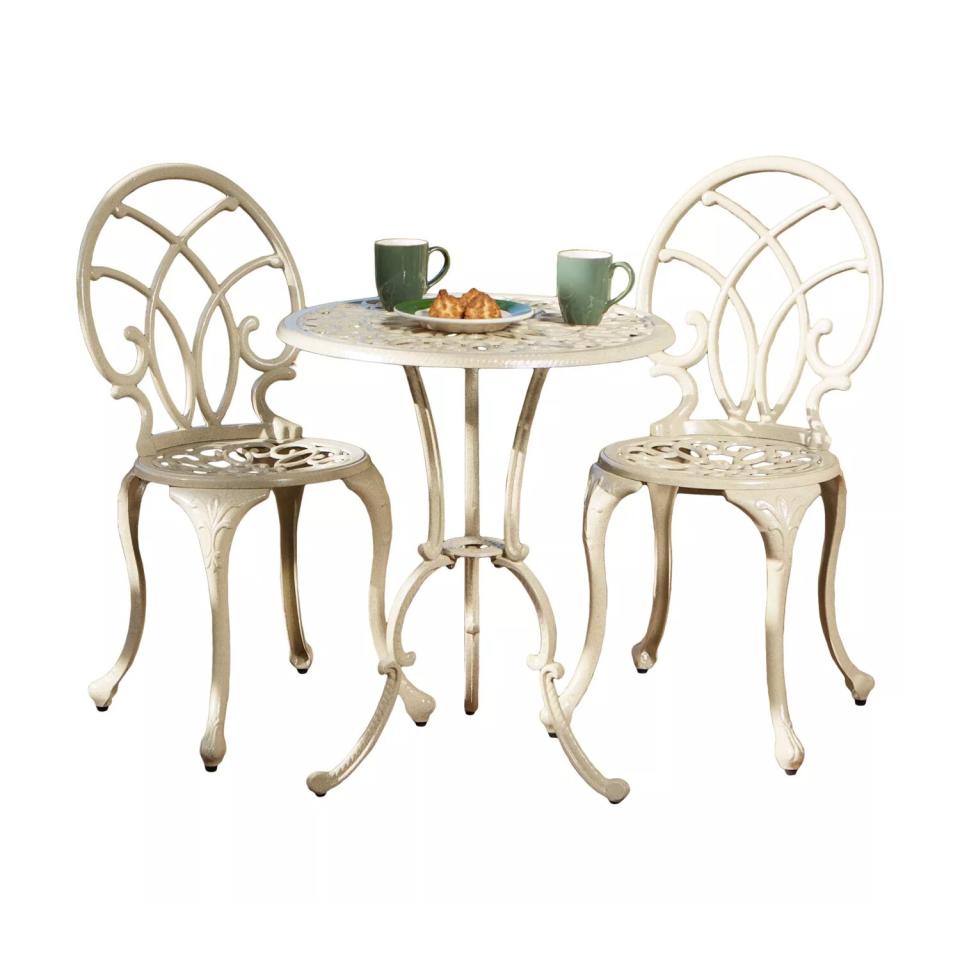 three-piece white bistro set with coffee cups and food