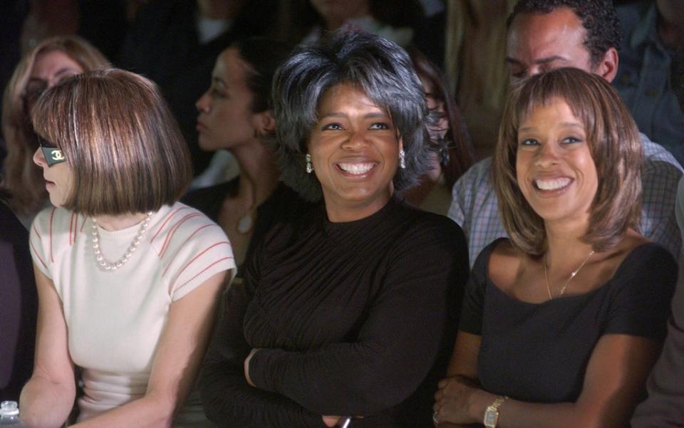 Talk show host Oprah Winfrey (C), Vogue editor Anna Wintour (L) and Oprah Magazine editor Gayle King attend the Vera Wang Spring/Summer 2003 Collection at the New York Public Library for Mercedes-Benz Fashion Week September 20, 2002 (Getty Images)