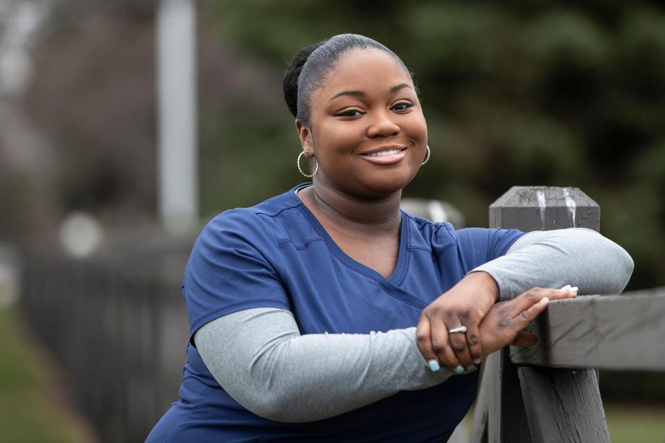 Lori Key, a nurse from St. Mary Mercy Livonia Hospital, poses for a photo outside of her home in Belleville on April 4, 2020.