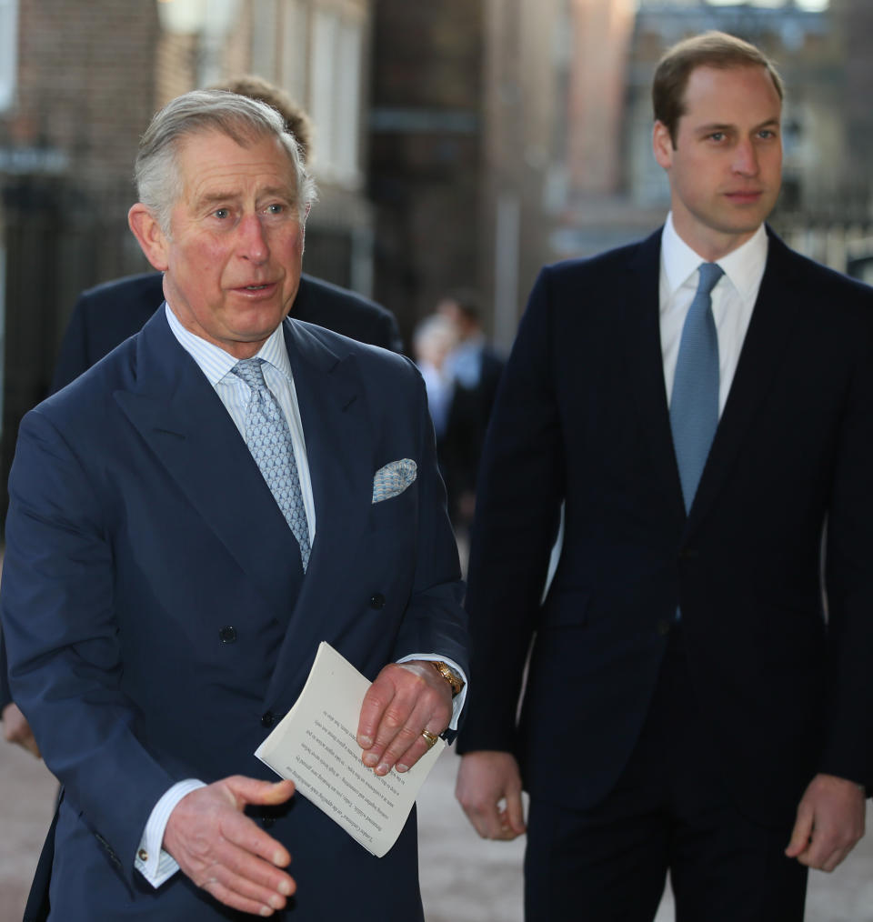 Britain's Prince Charles, left, with his sons Prince William, right, and Prince Harry, behind him, walks to Lancaster House to attend the Illegal Wildlife Trade Conference in London, Thursday, Feb. 13, 2014. (AP Photo/Alastair Grant, Pool)