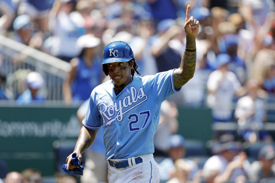 Kansas City Royals' Adalberto Mondesi reacts after scoring off a Jarrod Dyson double in the third inning of a baseball game against the Boston Red Sox at Kauffman Stadium in Kansas City, Mo., Sunday, June 20, 2021. (AP Photo/Colin E. Braley)