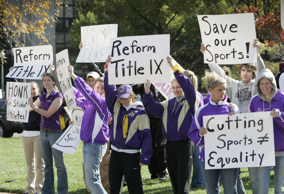 FILE - Students from James Madison University take part in a rally outside the Education Department in Washington, Thursday, Nov. 2, 2006. Earlier in 2006, James Madison announced that it would drop 10 of its athletic teams in order to bring the school into compliance with the federal law demanding equity in male and female sports. (AP Photo/Ron Edmonds, File)