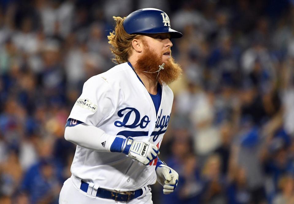 October 6, 2017; Los Angeles, CA, USA; Los Angeles Dodgers third baseman Justin Turner (10) runs after hitting an RBI single in the eighth inning against the Arizona Diamondbacks in game one of the 2017 NLDS at Dodger Stadium. Mandatory Credit: Richard Mackson-USA TODAY Sports
