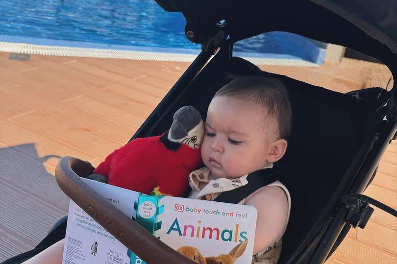 Jude read his book by the pool