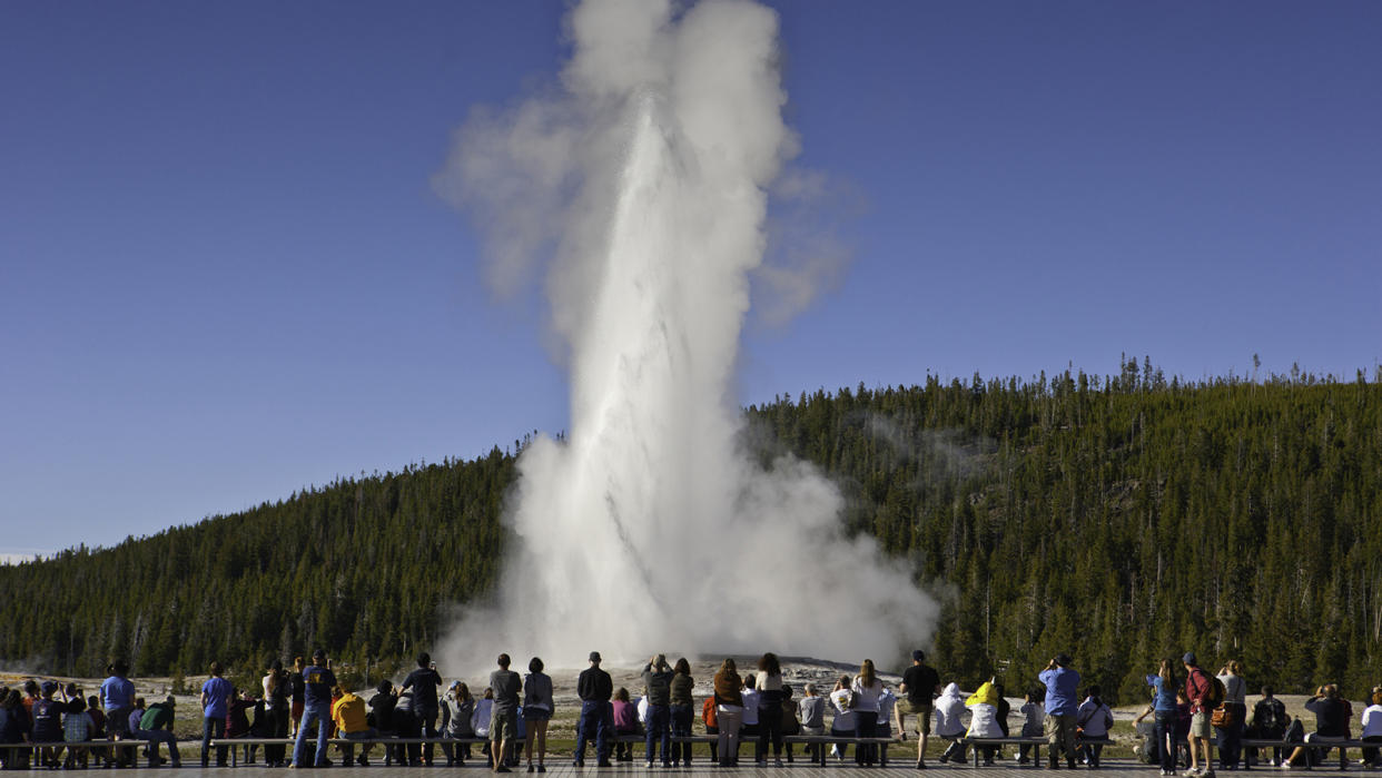 Tourists watching Old Faithful, Yellowstone National Park