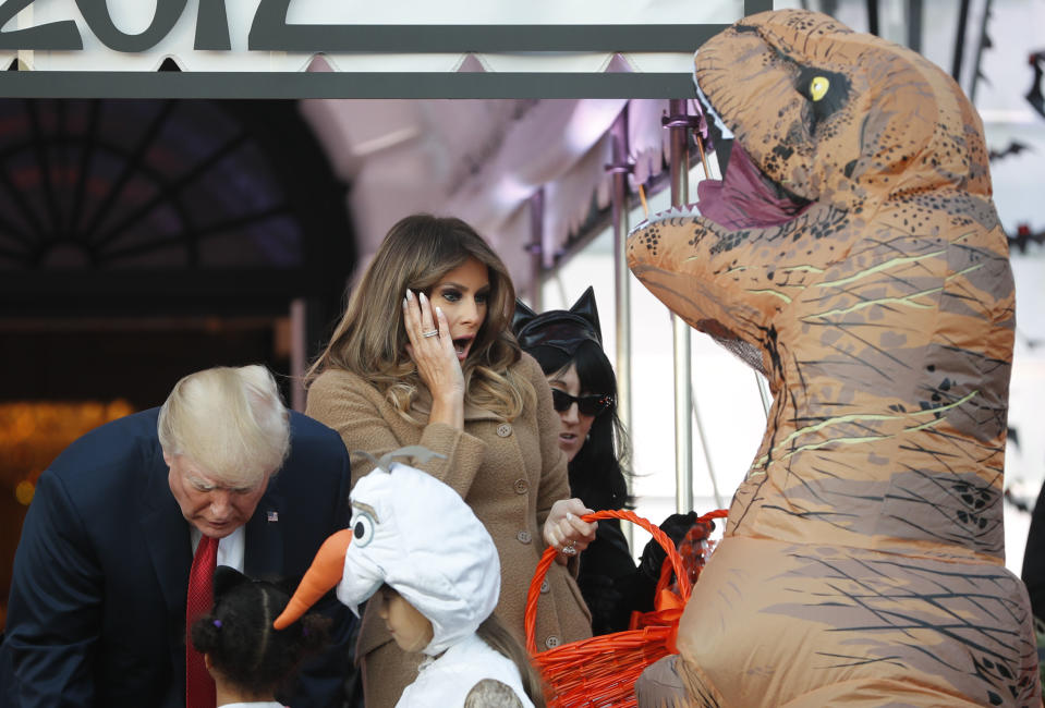 <p>President Donald Trump and first lady Melania Trump hand out treats as they welcome children from the Washington area and children of military families to trick-o-treat celebrating Halloween at the South Lawn of the White House in Washington, Oct. 30, 2017. (Photo: Pablo Martinez Monsivais/AP) </p>