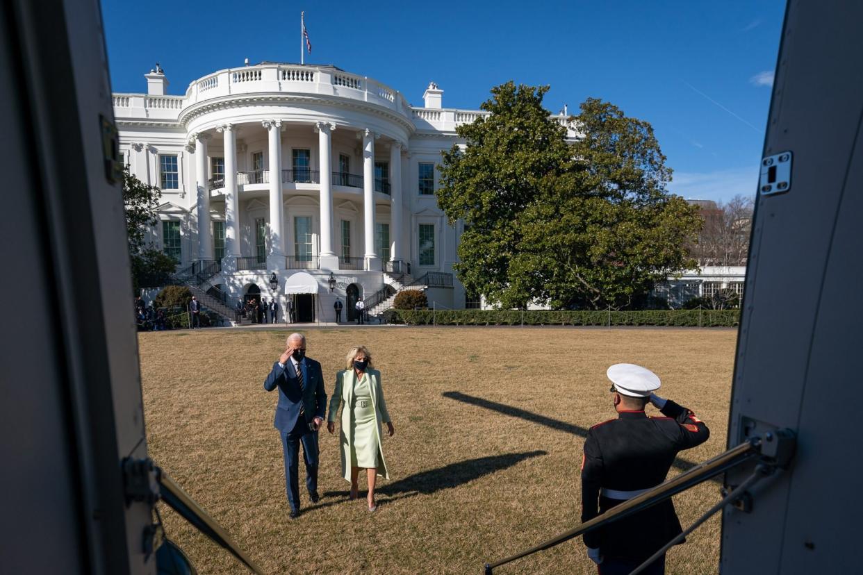 President Joe Biden.joined by First Lady Jill Biden, salutes a U.S. Marine as he prepares to board Marien One on the South Lawn of the White House Friday, March 12,