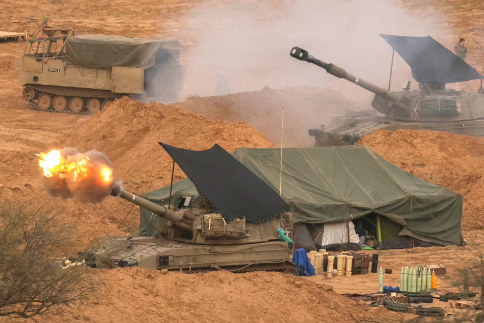 An Israeli army self-propelled artillery howitzer fires rounds from a position near the border with the Gaza Strip in southern Israel (Jack Guez / AFP - Getty Images)