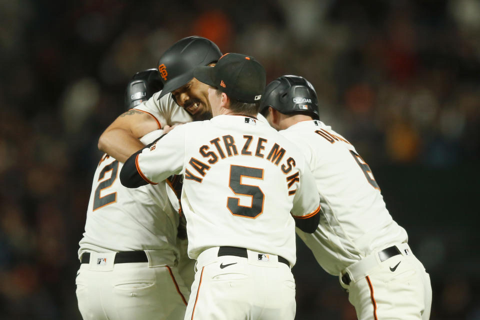 SAN FRANCISCO, CALIFORNIA - SEPTEMBER 30: LaMonte Wade Jr. #31 of the San Francisco Giants celebrates with teammates after hitting a walk-off RBI single in the bottom of the ninth inning to beat the Arizona Diamondbacks at Oracle Park on September 30, 2021 in San Francisco, California. (Photo by Lachlan Cunningham/Getty Images)