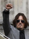 American actor Johnny Depp, gestures as he leaves after the end of the trial at the High Court in London, Tuesday, July 28, 2020. Hollywood actor Johnny Depp is suing News Group Newspapers over a story about his former wife Amber Heard, published in The Sun in 2018 which branded him a 'wife beater', a claim he denies. (AP Photo/Alberto Pezzali)