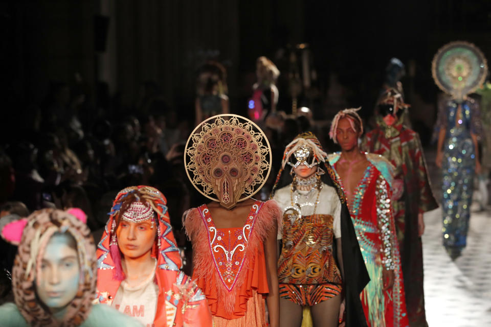 Models wear creations as part of the Manish Arora ready to wear Fall-Winter 2019-2020 collection, that was presented in Paris, Thursday, Feb. 28, 2019. (AP Photo/Christophe Ena)