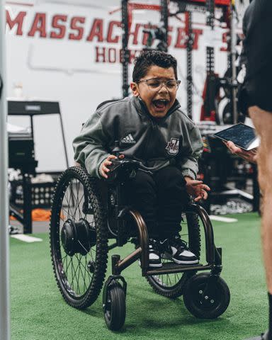 <p>Team IMPACT</p> Adrian Diaz motivating his hockey teammates