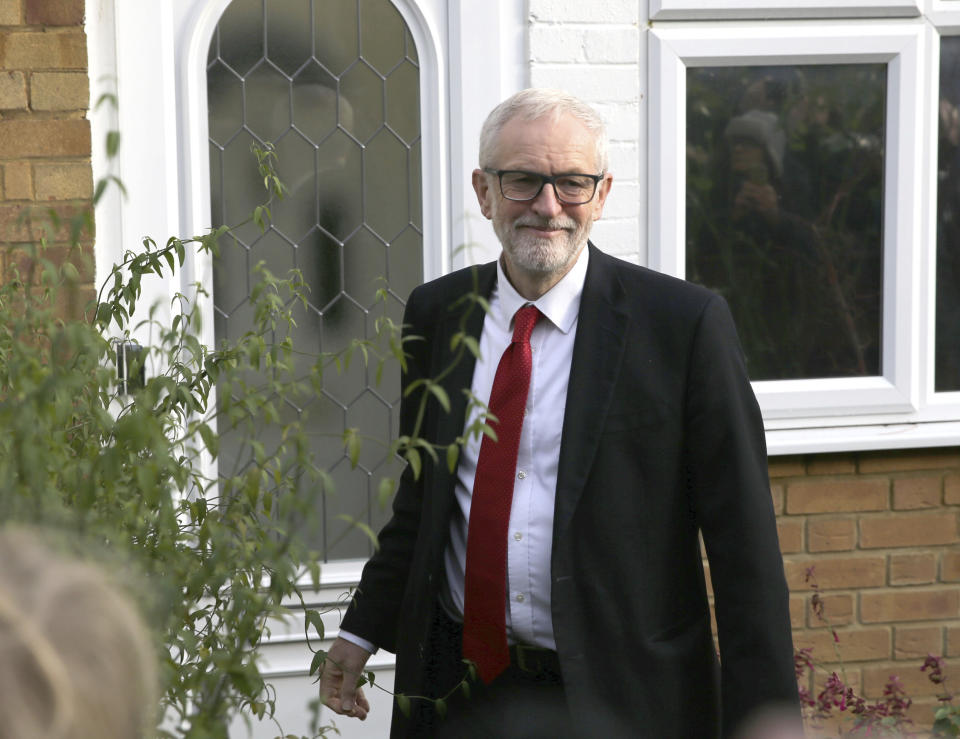 Britain's Labour Party leader Jeremy Corbyn leaves his home in Islington, north London, Friday Dec. 13, 2019, after Prime Minister Boris Johnson led his Conservative Party to a landslide victory in Britain’s election that was dominated by Brexit. (Isabel Infantes/PA via AP)