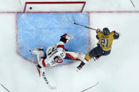 Vegas Golden Knights center Brett Howden (21) scores around Florida Panthers goaltender Sergei Bobrovsky (72) during the second period of Game 2 of the NHL hockey Stanley Cup Finals, Monday, June 5, 2023, in Las Vegas. (AP Photo/Abbie Parr)