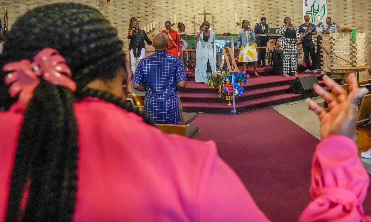 Pange Bibiche Tshabu, middle, sings during a French-language service for African immigrants on Sunday, Sept. 10, 2023, at Benediction Lutheran Church.