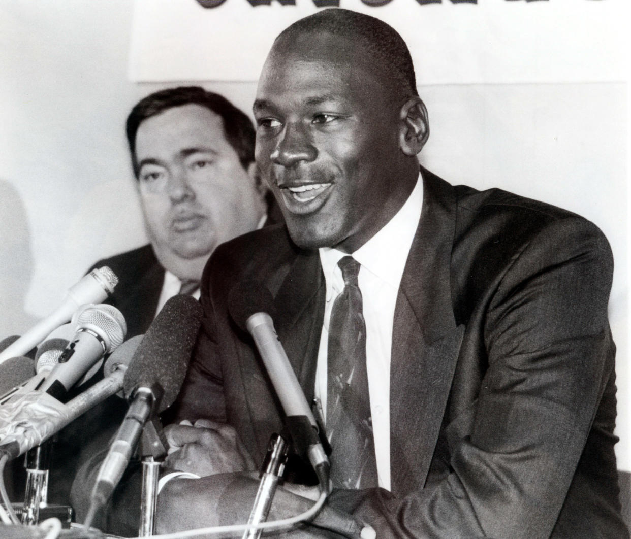 Jerry Krause, left, general manager of the Chicago Bulls, is shown with Bulls legend Michael Jordan in this Sept. 20, 1988 photo after Jordan agreed to an eight-year contract extension. Krause, who built a team around Jordan that won six national titles, resigned Monday, April 7, 2003, citing health problems. (AP Photo/Mark Elias)