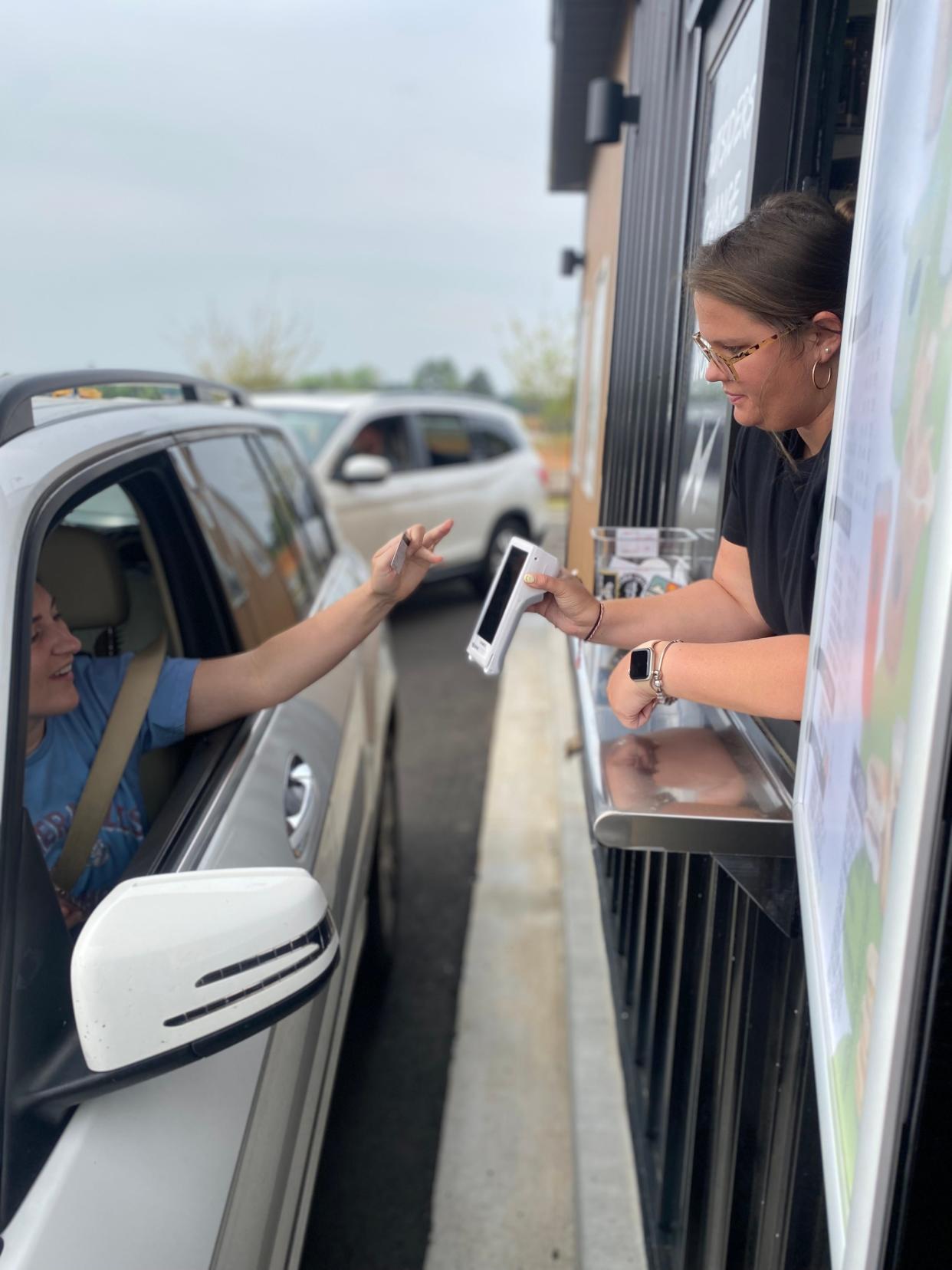 Clemson Resident Allye Lamb buys her first cup of Outsider Coffee