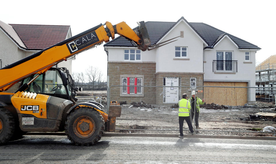 Workmen at CALA Homes West close their building site down in Larbert in Scotland on the day after Prime Minister Boris Johnson put the UK in lockdown, and First Minister Nicola Sturgeon called for construction sites to close, to help curb the spread of the coronavirus.