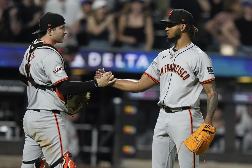 San Francisco Giants' Camilo Doval, right, celebrates with catcher Patrick Bailey, left, after a baseball game against the New York Mets, Friday, May 24, 2024, in New York. (AP Photo/Frank Franklin II)